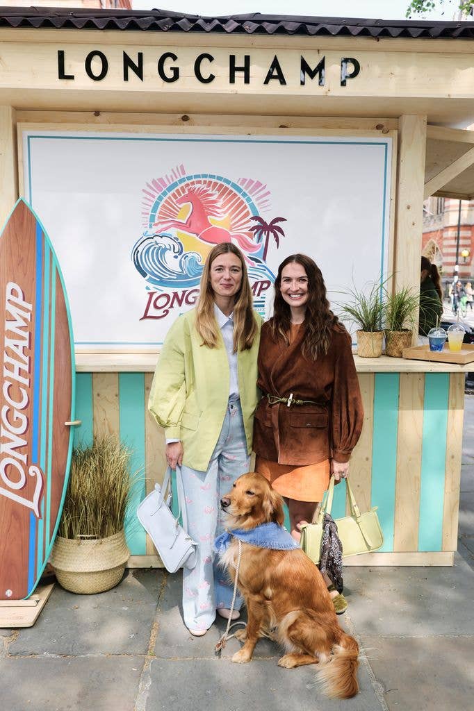 Alizee Thevenet posed with Juliette Poupard on street with dog