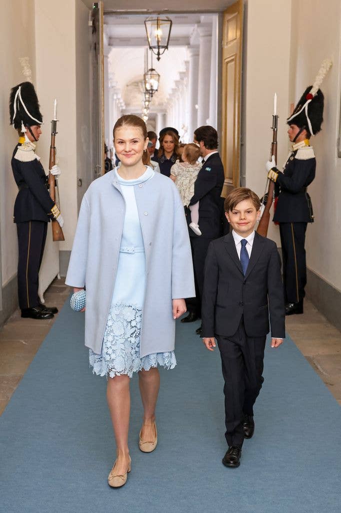Princess Estelle of Sweden in blue dress and Prince Oscar of Sweden in suit arrive at the Royal Palace Church 