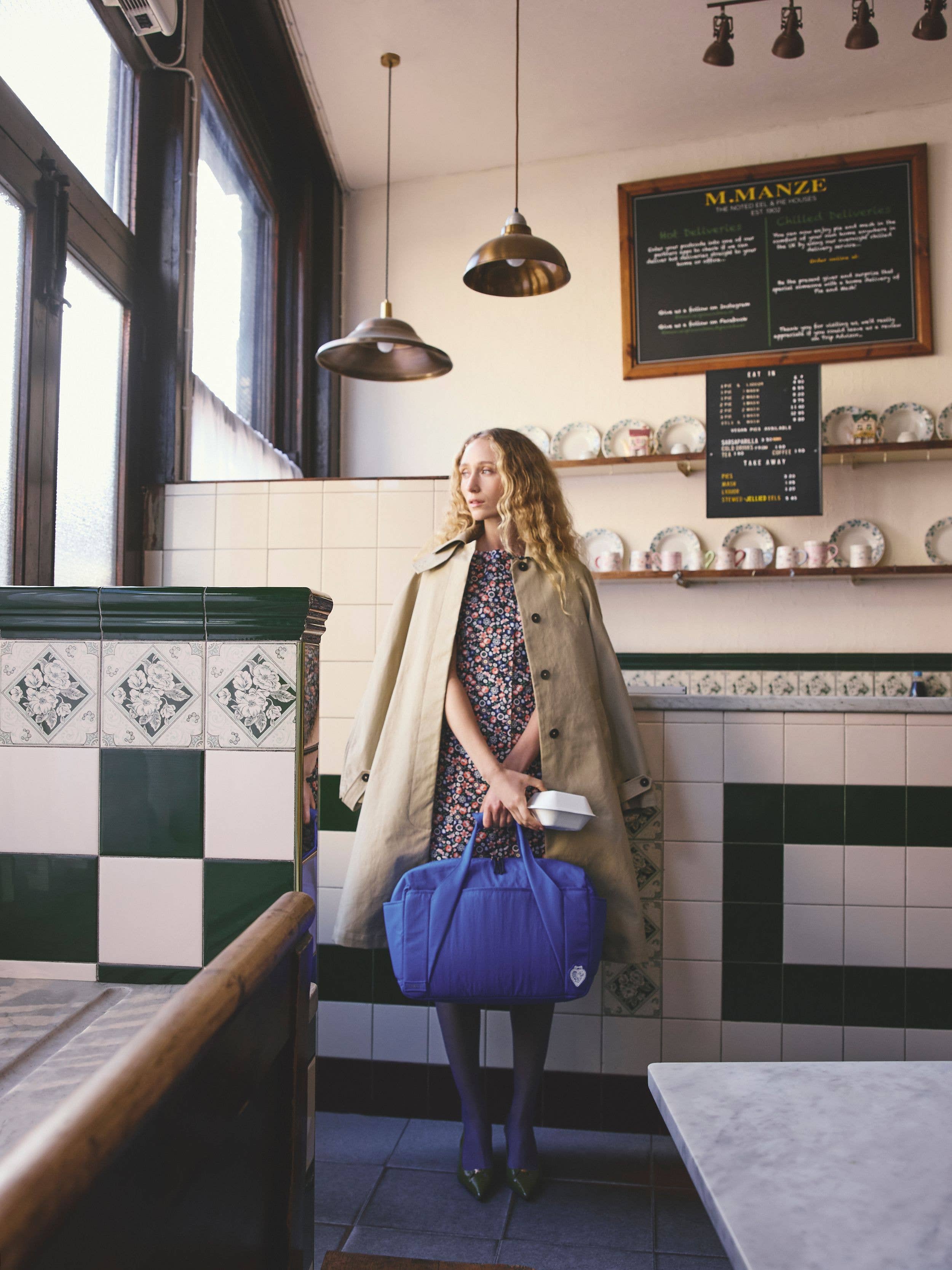 model in pie & mash shop wearing Cath Kidston SS26 collection